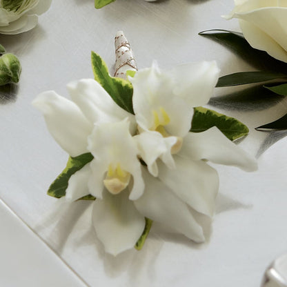 White Mini Cymbidium Boutonniere –  Bush Flower Shop, North Augusta SC